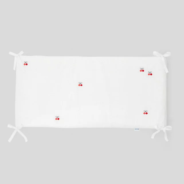 Bed bumper with embroidered cherries